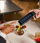 Restaurant waiter in Colleyville getting tipped by restaurant customer
